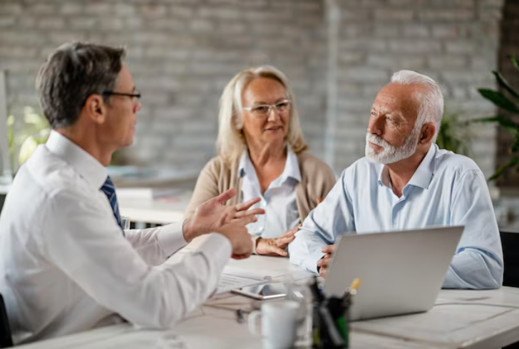 Senior couple meeting financial advisor